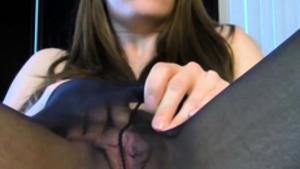 Solo brunette masturbation wearing pantyhose