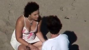Amateur voyeur sensual kissing at the beach